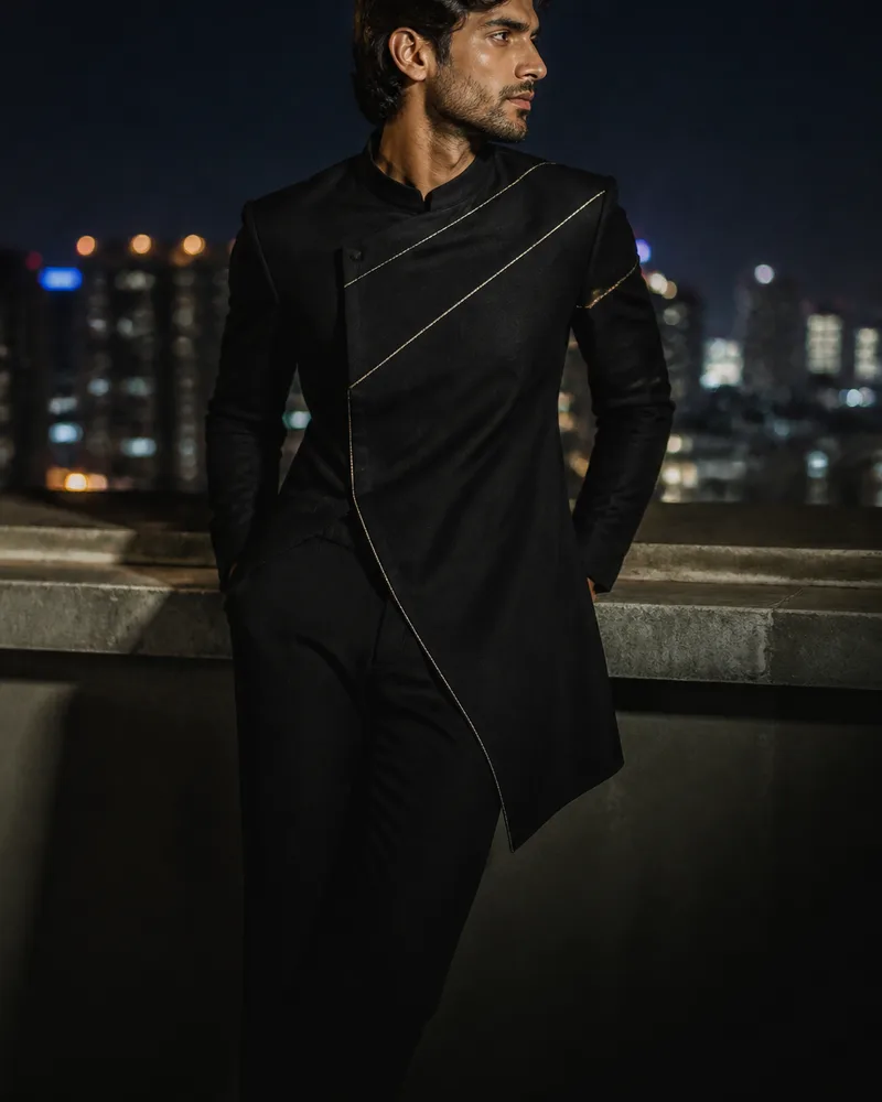 Man in a black asymmetric indo-western jacket